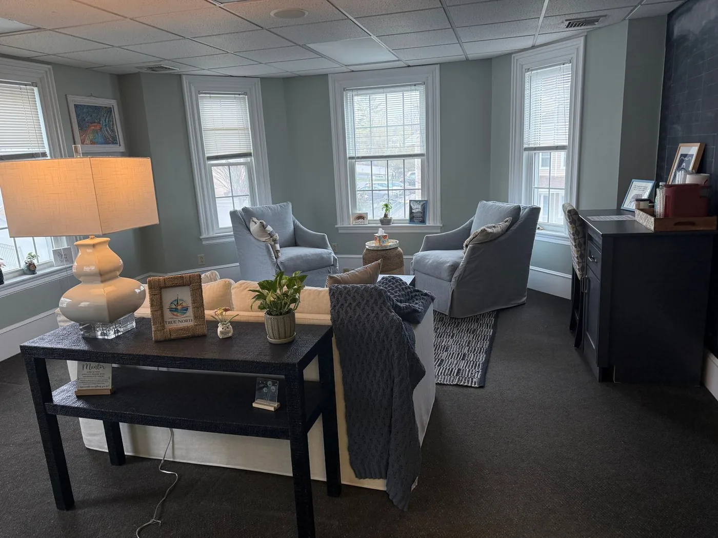 True North Counseling office in Plymouth MA showing cozy seating area and True North branded decor